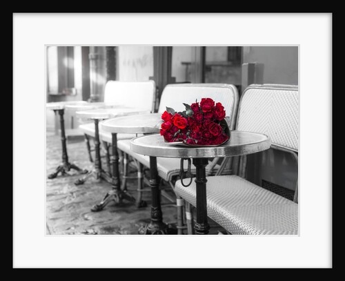 Bunch of flowers on cafe table by Assaf Frank